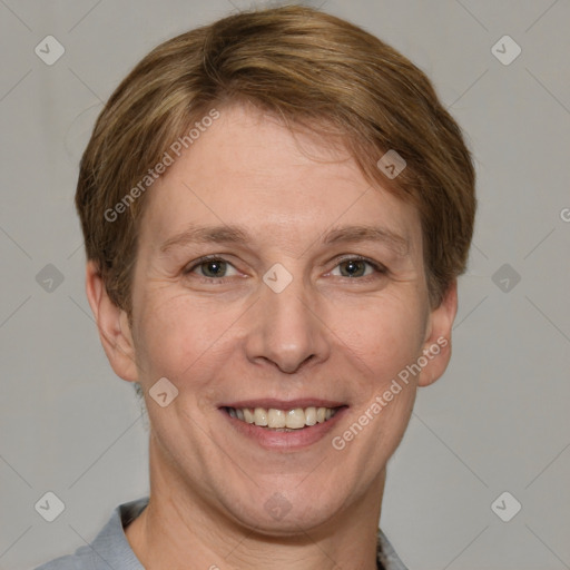 Joyful white adult female with short  brown hair and grey eyes