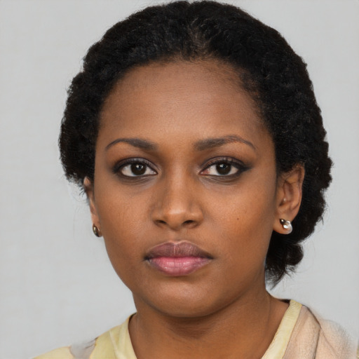Neutral black young-adult female with short  black hair and brown eyes