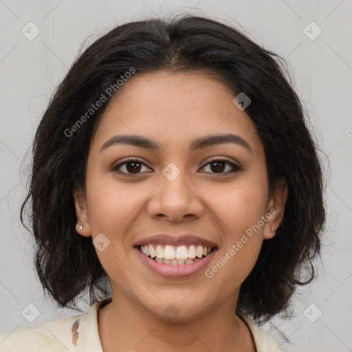 Joyful latino young-adult female with medium  brown hair and brown eyes