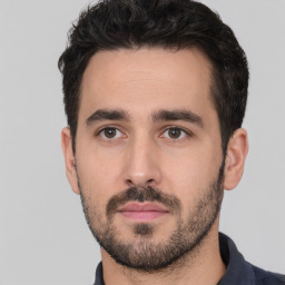 Neutral white young-adult male with short  black hair and brown eyes