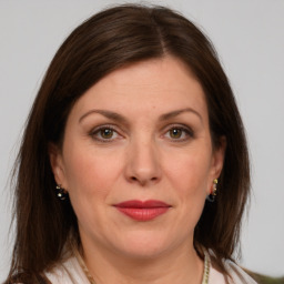 Joyful white adult female with medium  brown hair and grey eyes