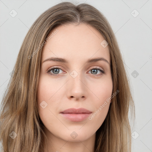 Neutral white young-adult female with long  brown hair and green eyes