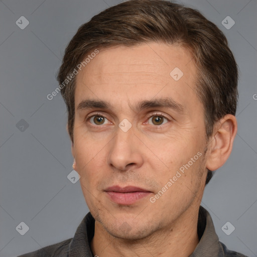 Joyful white adult male with short  brown hair and brown eyes