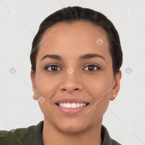 Joyful white young-adult female with short  black hair and brown eyes