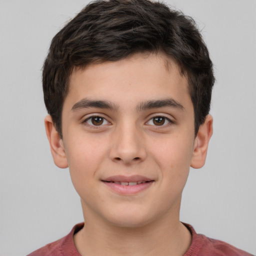Joyful white child male with short  brown hair and brown eyes