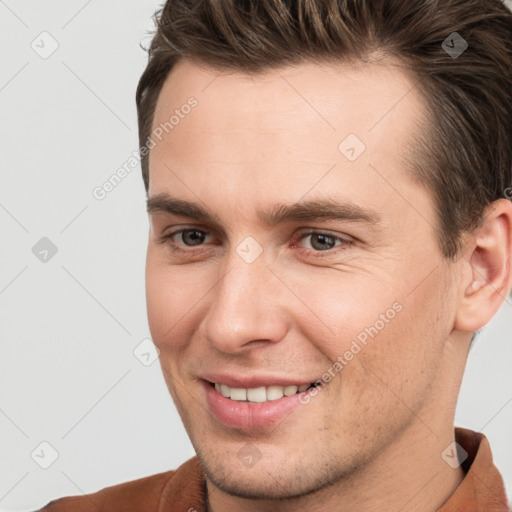 Joyful white young-adult male with short  brown hair and brown eyes