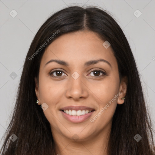 Joyful latino young-adult female with long  brown hair and brown eyes