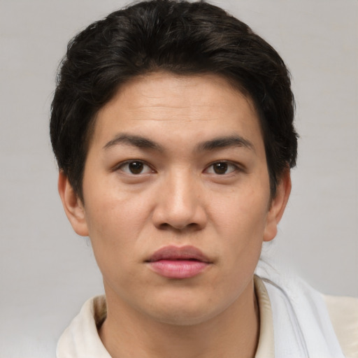 Joyful asian young-adult female with short  brown hair and brown eyes