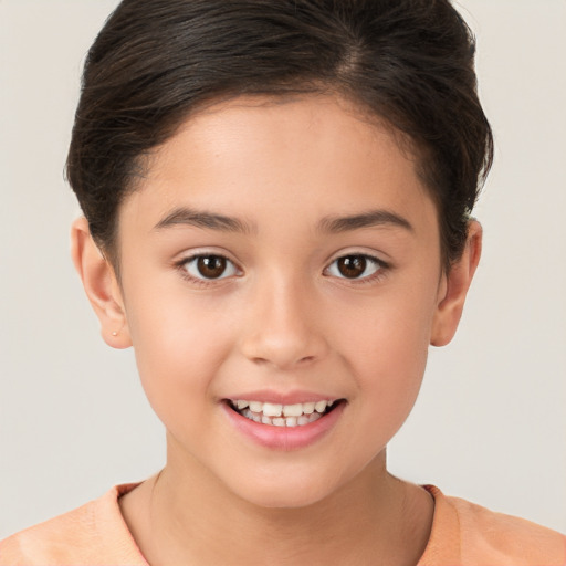 Joyful white child female with short  brown hair and brown eyes