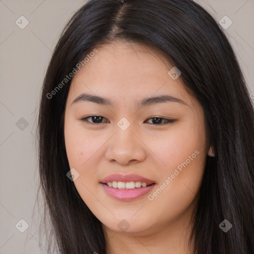 Joyful asian young-adult female with long  brown hair and brown eyes