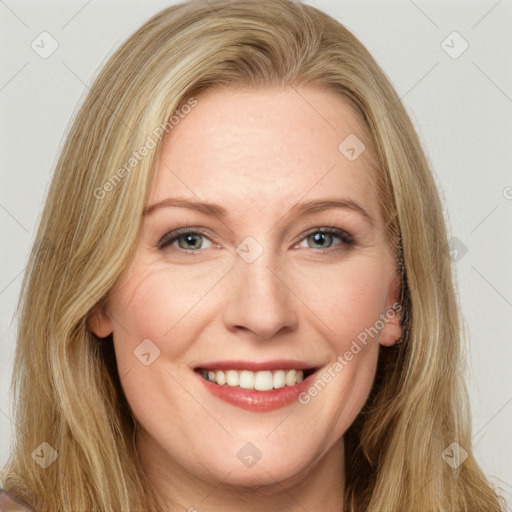 Joyful white young-adult female with long  brown hair and green eyes