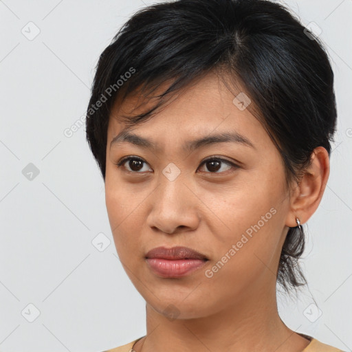 Joyful asian young-adult female with medium  brown hair and brown eyes