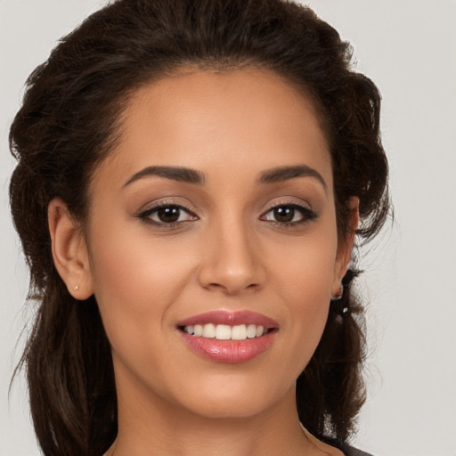 Joyful white young-adult female with long  brown hair and brown eyes