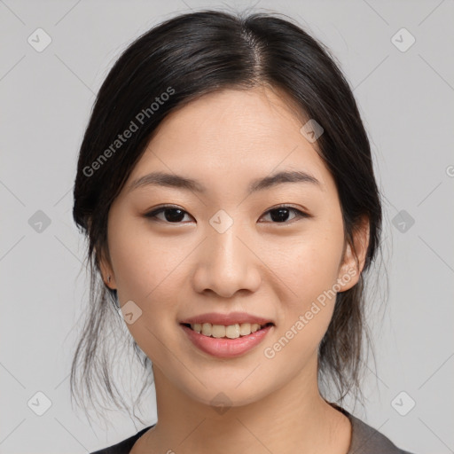 Joyful asian young-adult female with medium  black hair and brown eyes