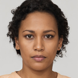 Neutral black young-adult female with short  brown hair and brown eyes