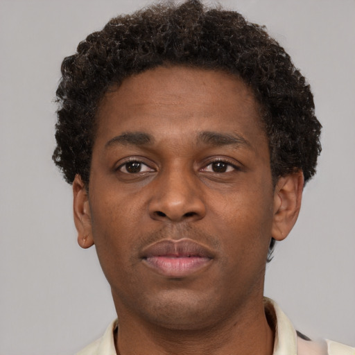 Neutral black young-adult male with short  brown hair and brown eyes