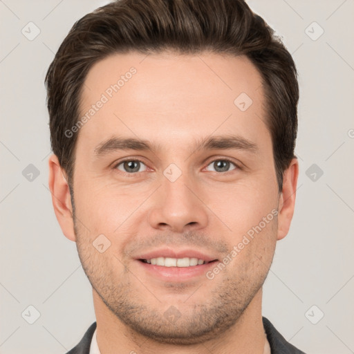 Joyful white young-adult male with short  brown hair and brown eyes