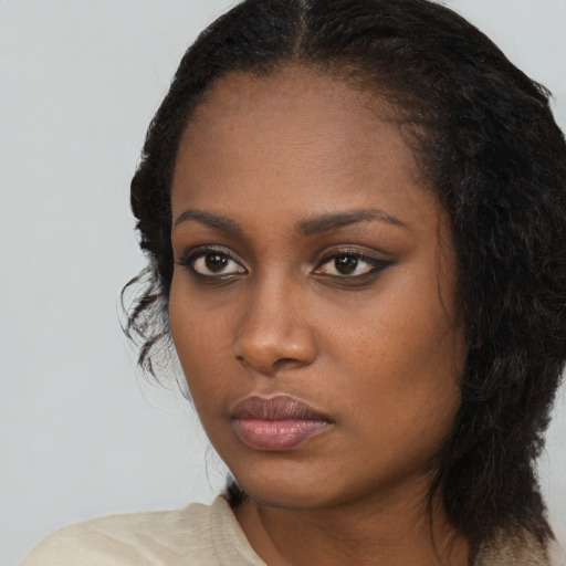 Neutral black young-adult female with long  black hair and brown eyes