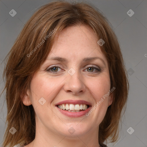 Joyful white young-adult female with medium  brown hair and blue eyes