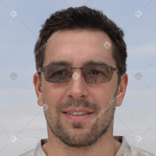 Joyful white adult male with short  brown hair and brown eyes