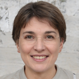 Joyful white adult female with short  brown hair and brown eyes