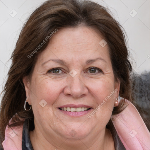 Joyful white adult female with long  brown hair and grey eyes