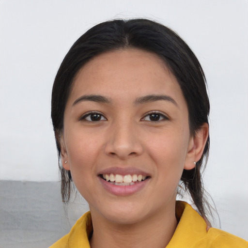 Joyful asian young-adult female with long  black hair and brown eyes