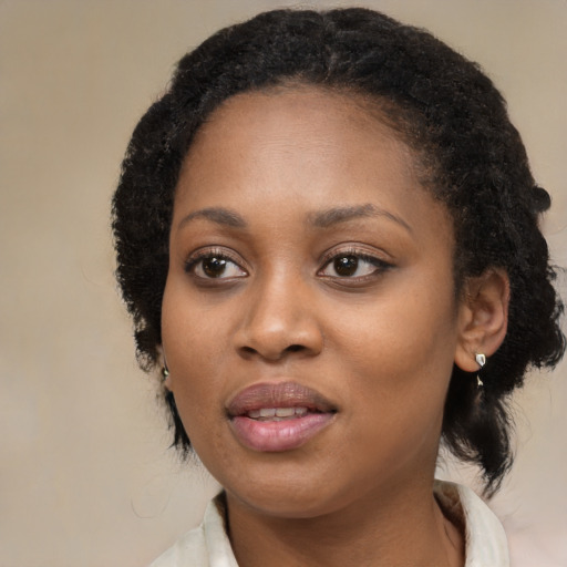 Joyful black young-adult female with medium  black hair and brown eyes