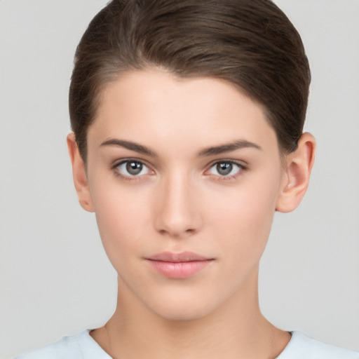 Neutral white young-adult female with short  brown hair and brown eyes