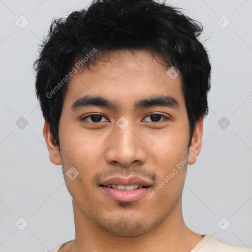 Joyful asian young-adult male with short  black hair and brown eyes