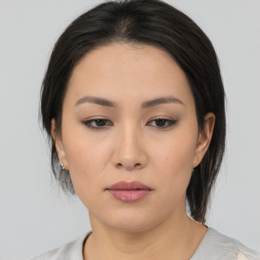 Neutral asian young-adult female with medium  black hair and brown eyes