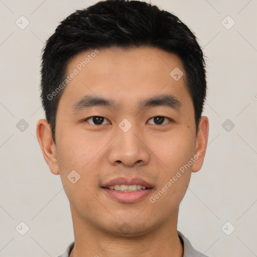 Joyful asian young-adult male with short  black hair and brown eyes