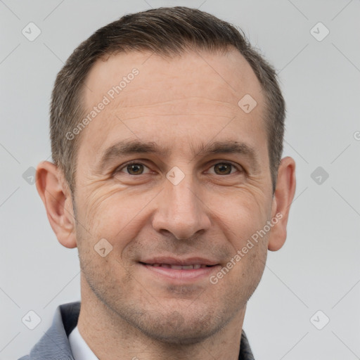 Joyful white adult male with short  brown hair and brown eyes