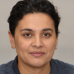 Joyful white adult female with short  brown hair and brown eyes