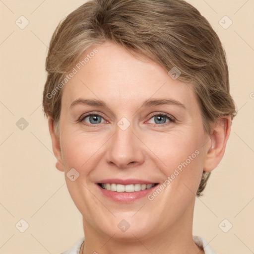 Joyful white adult female with short  brown hair and grey eyes