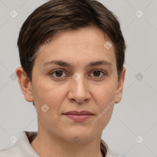 Joyful white young-adult female with short  brown hair and grey eyes