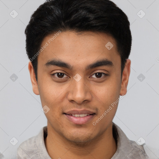 Joyful latino young-adult male with short  black hair and brown eyes