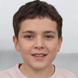 Joyful white child male with short  brown hair and brown eyes