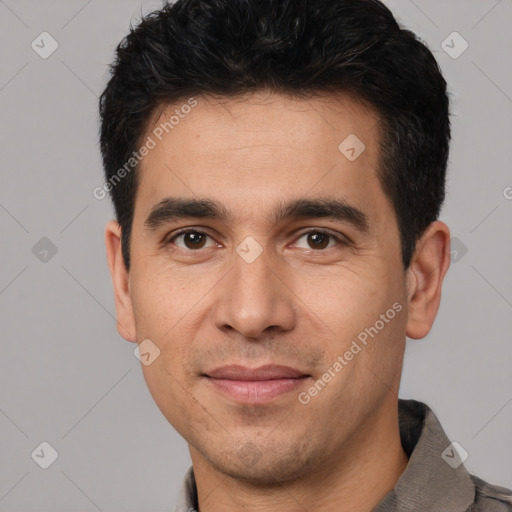 Joyful white young-adult male with short  black hair and brown eyes