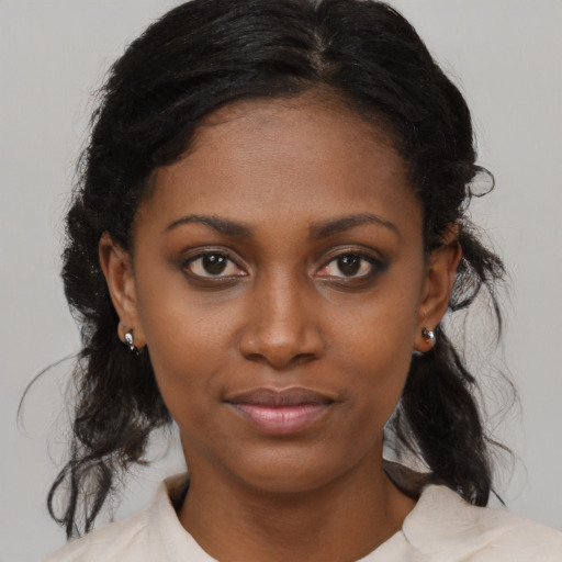 Joyful black young-adult female with medium  black hair and brown eyes