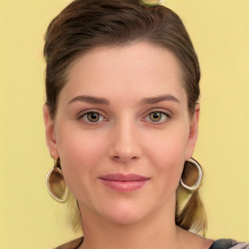 Joyful white young-adult female with long  brown hair and green eyes