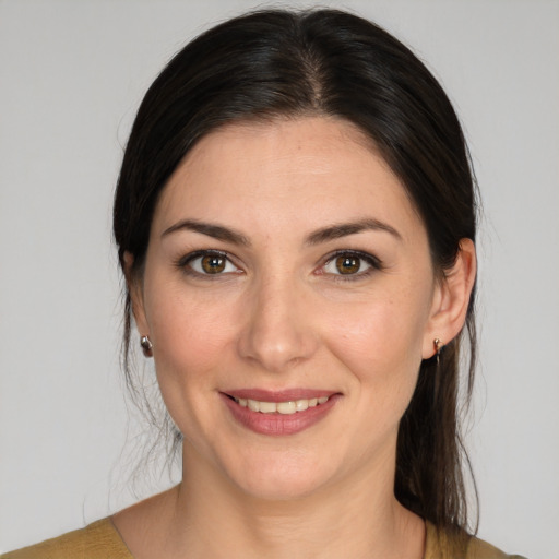 Joyful white young-adult female with medium  brown hair and brown eyes