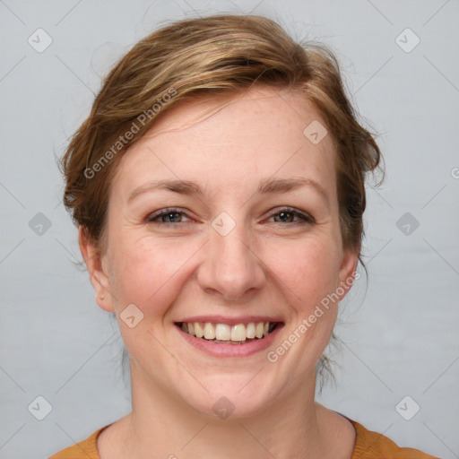 Joyful white adult female with medium  brown hair and grey eyes