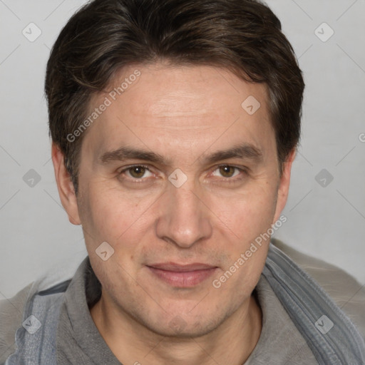 Joyful white adult male with short  brown hair and grey eyes