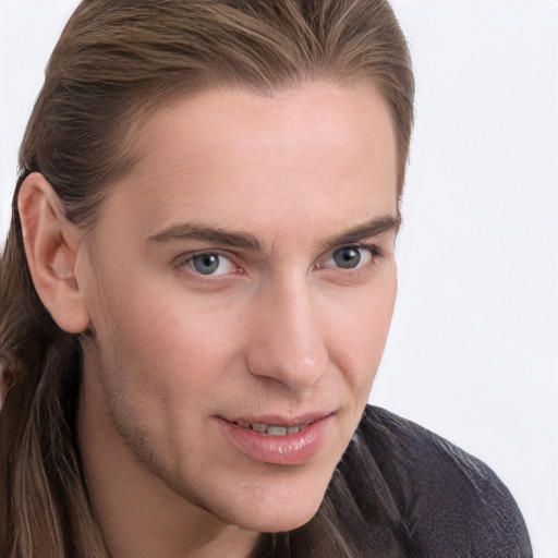 Joyful white young-adult male with long  brown hair and grey eyes