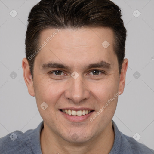 Joyful white adult male with short  brown hair and brown eyes