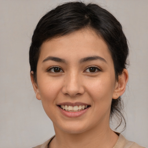 Joyful white young-adult female with medium  brown hair and brown eyes