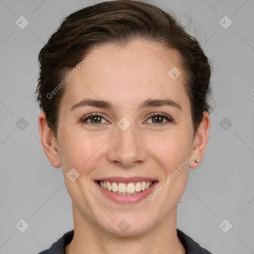 Joyful white young-adult female with short  brown hair and grey eyes