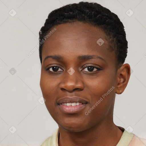 Joyful black young-adult female with short  black hair and brown eyes