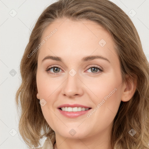 Joyful white young-adult female with long  brown hair and green eyes